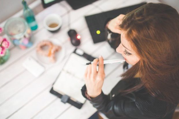 woman-hand-desk-office pexels